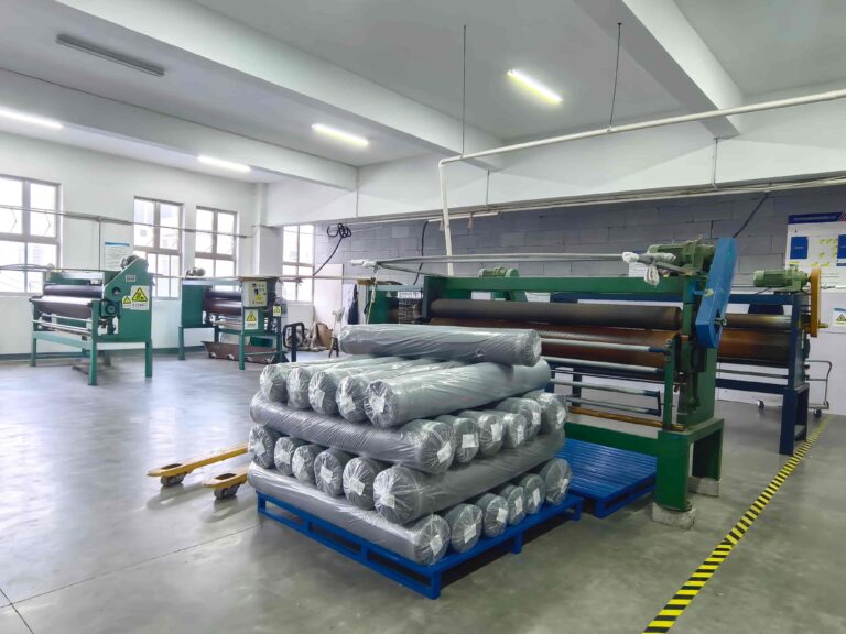 Textile finishing line with fabric rolls