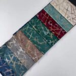 Warp Knitted Gold Stamping Velour Upholstery Fabric color swatch card at an angle